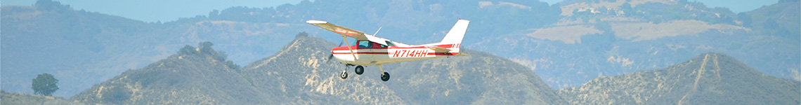 Cessna Flying in Mountains